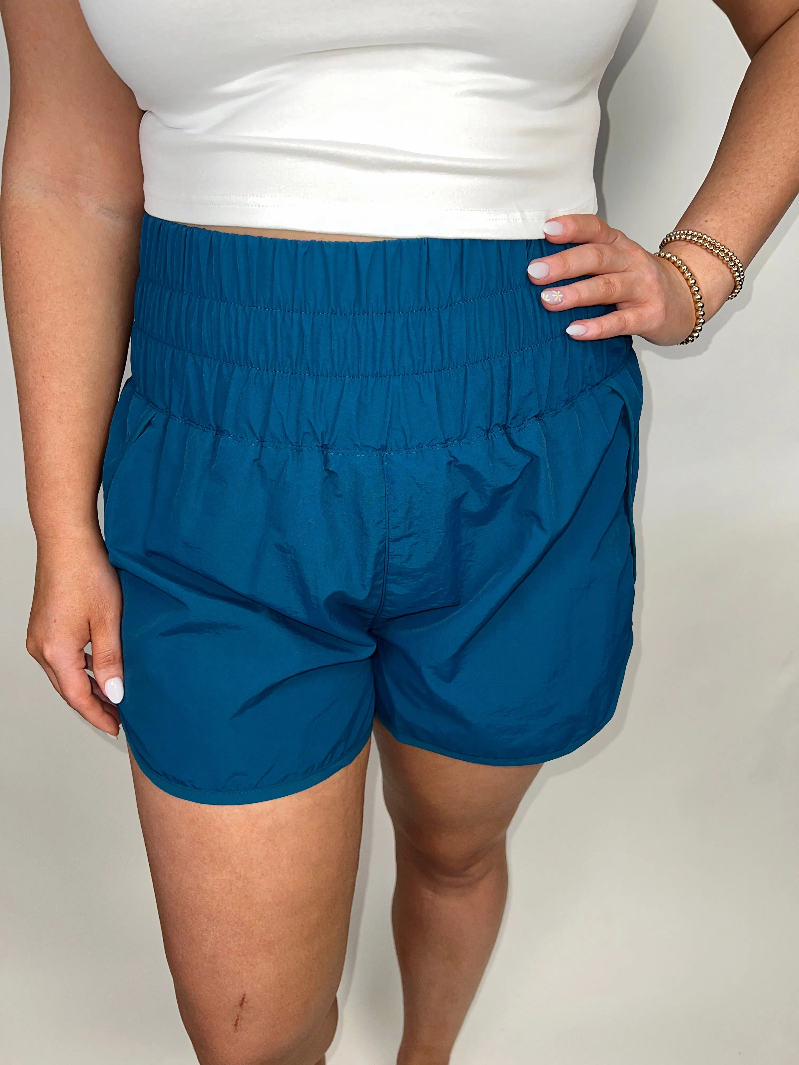 Errands To Run High Waist Windbreaker Short in Teal